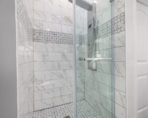 A City Tub to Shower Conversion featuring a Glass Door.