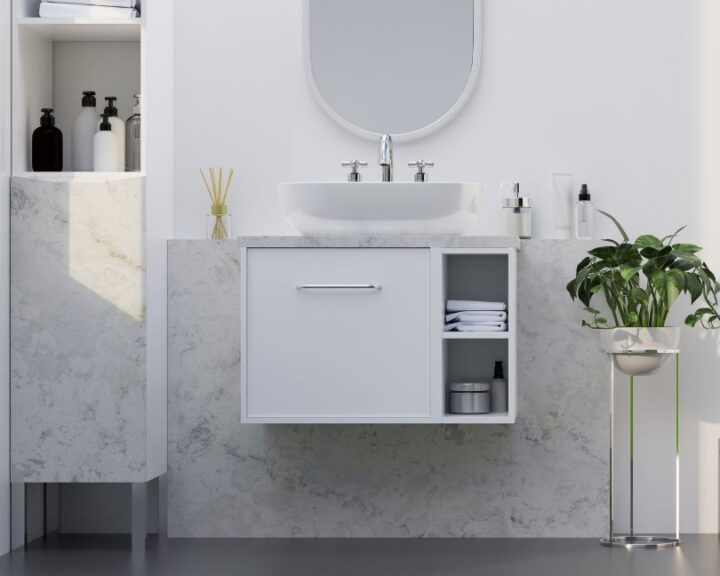 A city bathroom with a sink and mirror, enhanced with cabinets.