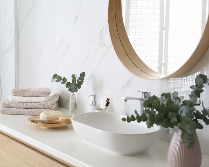 A remodeled city bathroom featuring a sink and a mirror.