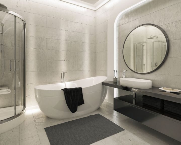 A walk-in shower and white bathtub in a bathroom remodel.