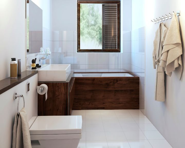 A city bathroom featuring a sink, toilet, and bathtub.